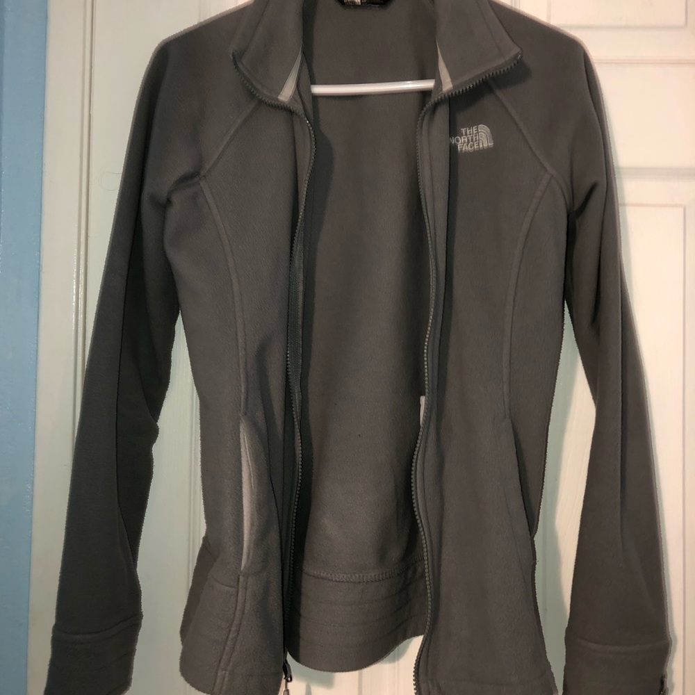 Grey North Face zip up sweater.